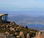 view from mt wellington with lookout building in foregraound and hobart and derwent mouth below 
